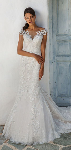 fit-and-flare wedding dress from justin alexander with embroidered bodice that extends throughout the skirt